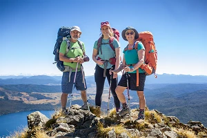 Trio of Trampers on Parachute Rocks, Lake Rotoiti, Nelson Lakes NP, NZ