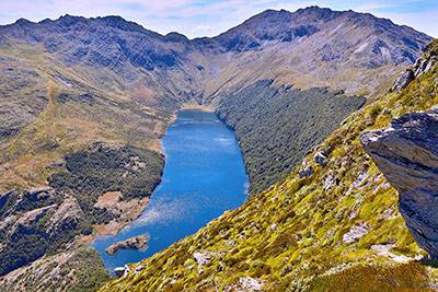 View of the remote Island Lake from Mt Gibbs - with the flanks of Aorere Peak beyond Island20Lake2020Aorere20Peak